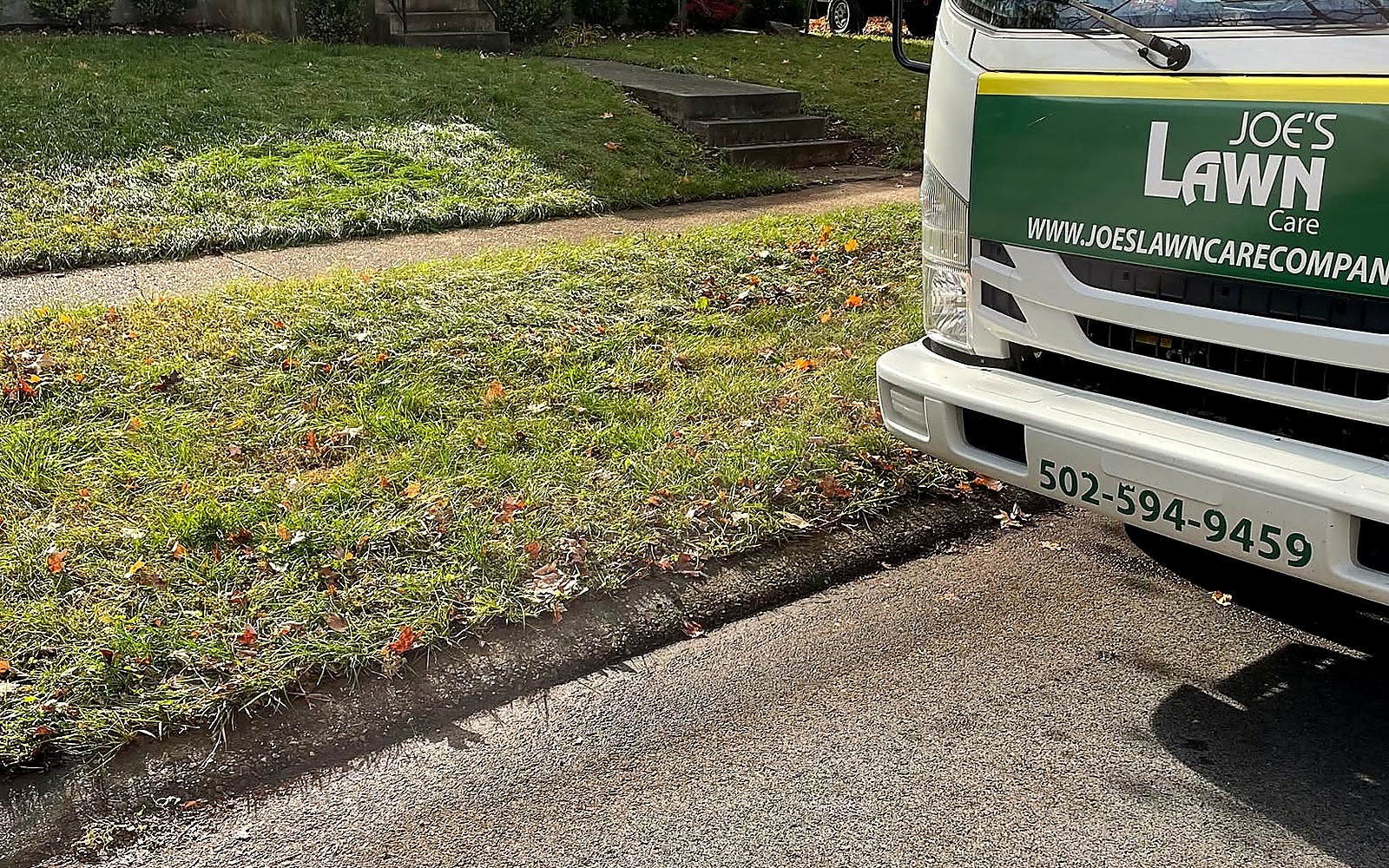 Joe's Lawn Care truck at a Louisville residential property